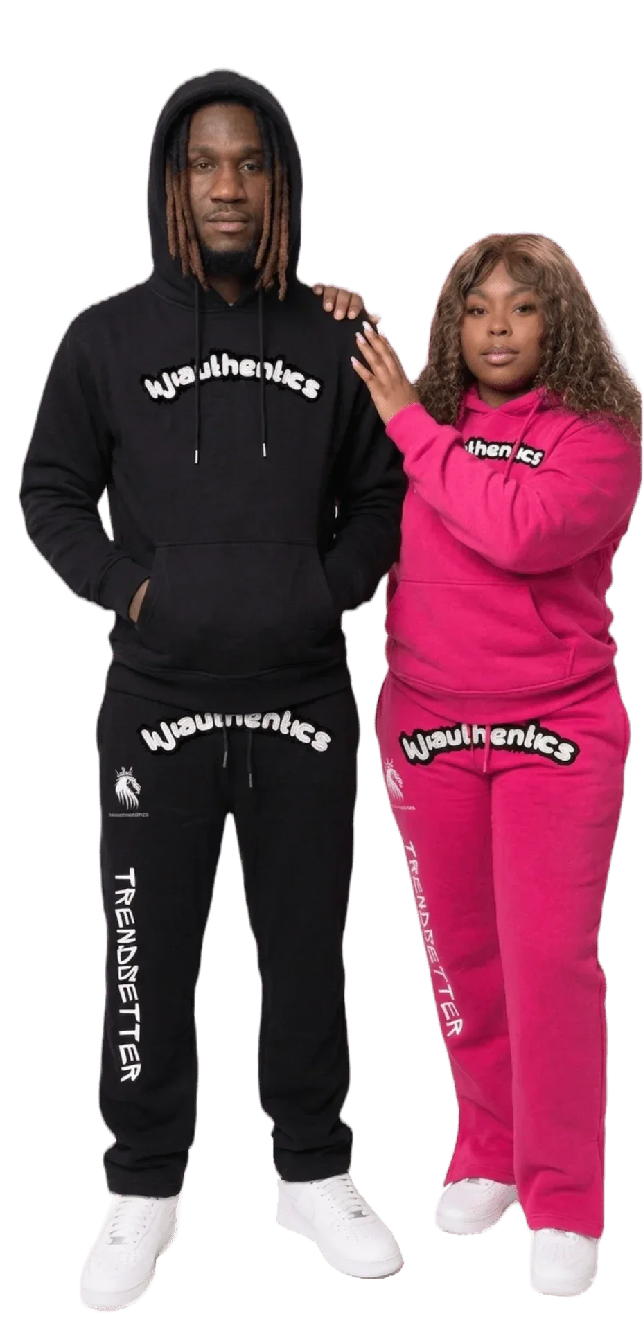 Matching black and pink hooded sweatsuits with bold graphic logos, streetwear style for couples