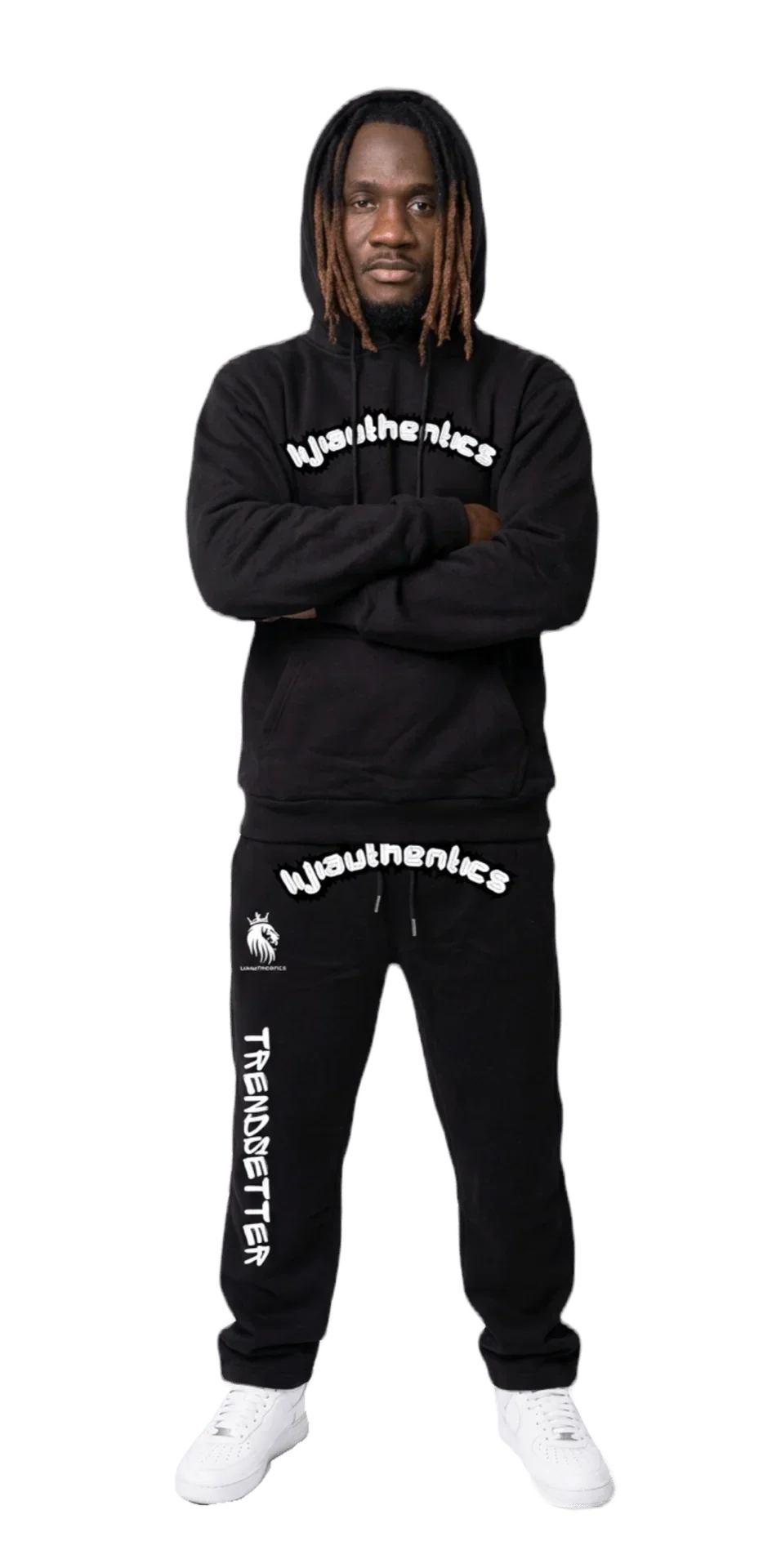 Black matching sweatsuit with bold white graphics, paired with white sneakers for streetwear style